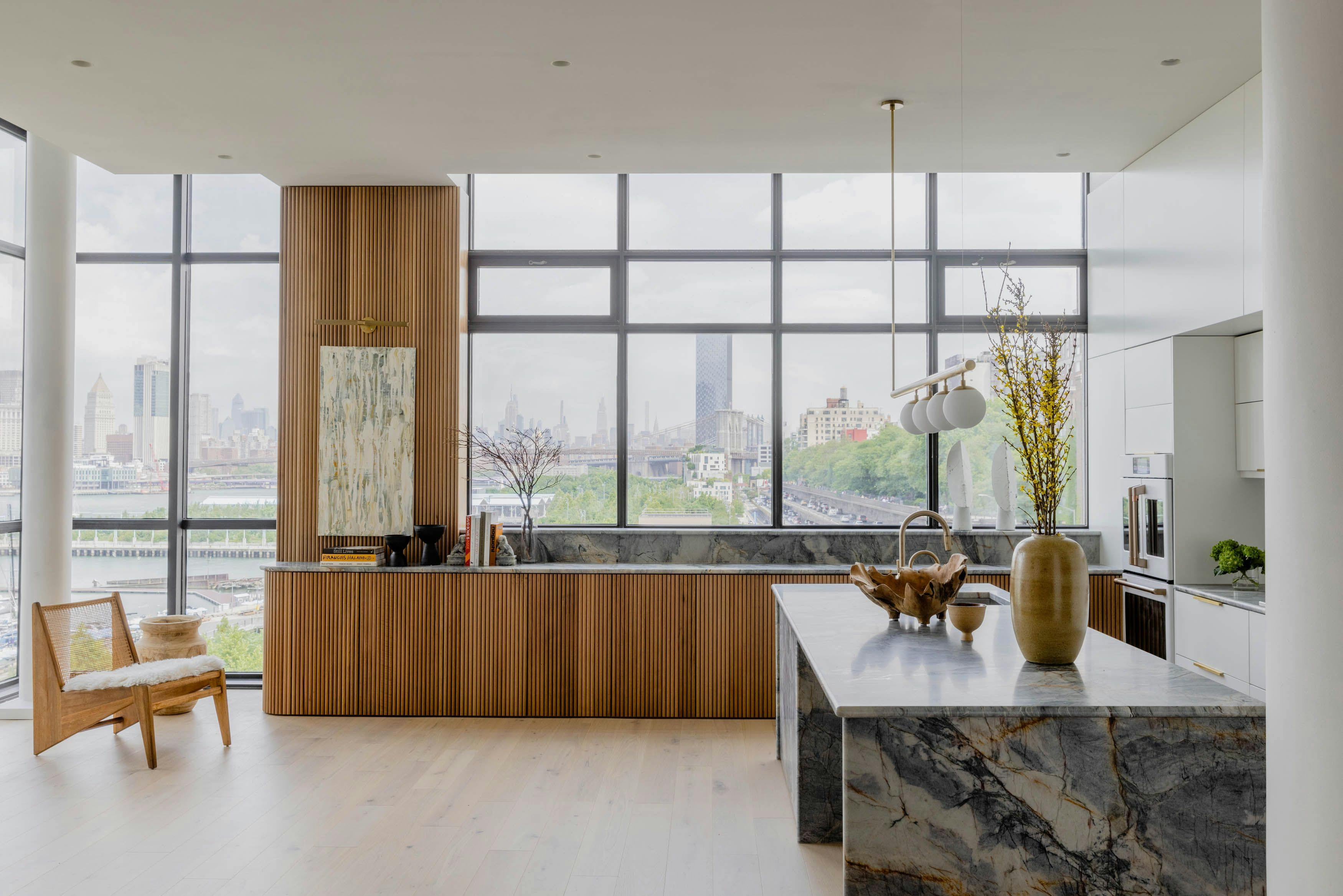 A city view and contemporary style with minimalistic design, cozy wooden elements, and a visually impressive kitchen island.